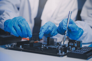 Close up of Technician measuring voltage electronic circuit board television, Service after sale fix electric equipment within insurance.