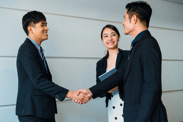 Business people agreement concept. Businessman do handshake with another businessman in the office...