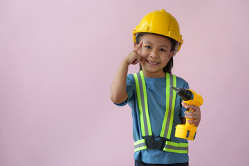Little handyman with tools Cute child is a construction worker playing with a screwdriver, hammer,...
