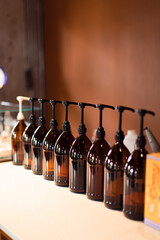 Empty bottles with pump lined up.