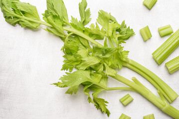 Fresh raw green celery leaf on metallic background, Vegetable from Organic farm ingredient for...