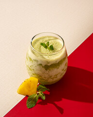 Pineapple juice and mint leaves are a liquid extract from the tropical plant pineapple to which mint leaves are added to make it fresher