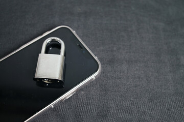 Phone Security. Smartphone and Padlock Isolated On Black Background. 