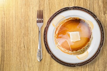 Tasty sweet pancakes with fresh berries on desk