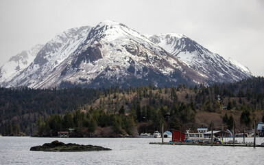 Snowcapped mountain overlooking Halibut Cove in the Kachemak bay near Homer Alaska United States