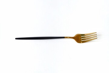 Golden fork isolated on white background