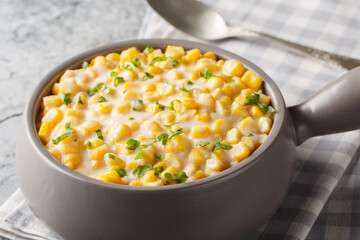 Homemade Slow Cooker Creamed Corn in a Bowl closeup on the bowl on the table. Horizontal