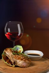 Red wine with tasty grilled meat in Restaurant