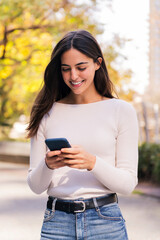 caucasian woman smiling happy using mobile phone