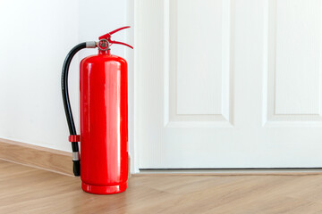 Fire extinguisher on wall, fire extinguisher in house