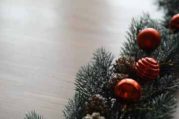Christmas tree with gift box and decorations on wooden background