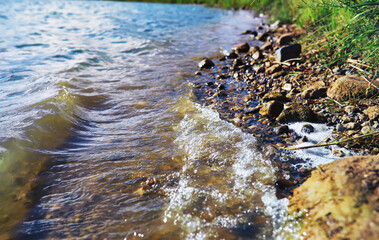 Water surface. The texture of the water. Waves on the lake in windy weather.