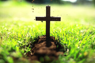 Concept conceptual black cross religion symbol silhouette in grass