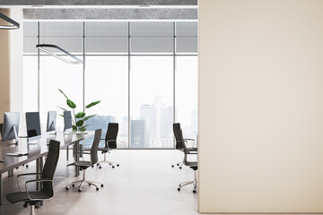 Clean wooden and concrete coworking office interior with empty mock up place on wall, panoramic...