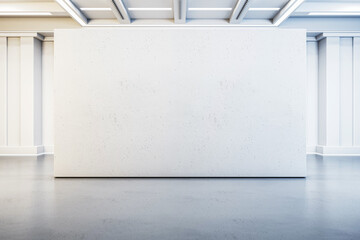 A blank white wall in a gallery with a contemporary design on a clean, grey floor, suitable for an...