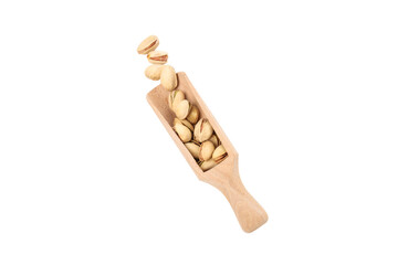 PNG, pistachios in a wooden spatula, isolated on white background.