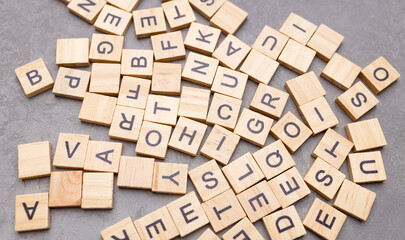 Magnifying glass with many wood letters of English alphabets, learning English concept