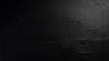 Black textured wooden background. Free space for design or text. Top views