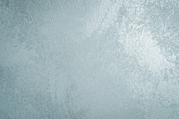 Silver glossy stone background. Beautiful Abstract Grunge Decorative Painted Stucco Wall Texture. Top view.