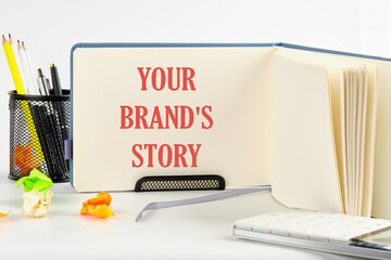 Business concept. Copy space. Concept words Your brands story on a blank sheet of an open business notebook