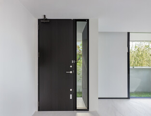 Security door of home black color made of wood.