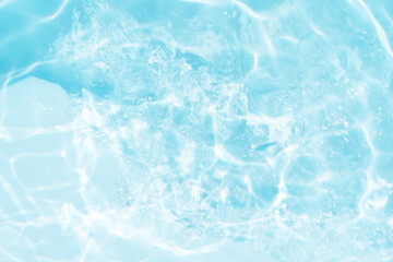 Blue water with ripples on the surface. Defocus blurred transparent blue colored clear calm water...