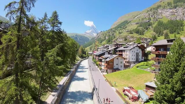 Zermatt, Switzerland, Europe in spring, flight towards Matterhorn and Swiss Alps mountains in the background.