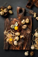 Quail eggs on a wooden board. Rustic style. Top view.