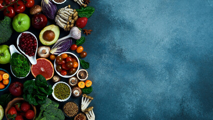 Healthy eating ingredients: fresh vegetables, fruits and superfood. Nutrition, diet, vegan food...