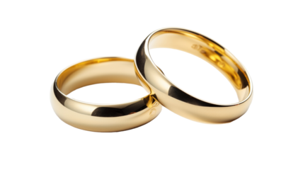 A pair of gold wedding rings isolated on transparent background.

