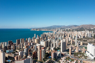 Aerial drone photo of the beautiful city of Benidorm in Spain in the summer time showing high rise...