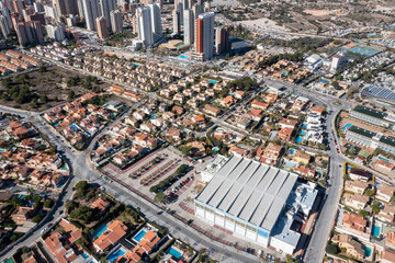 Aerial drone photo of the beautiful city of Benidorm in Spain in the summer time showing high rise...