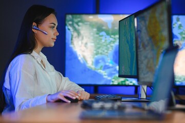 Photo of a successful dispatcher working on a computer in the office
