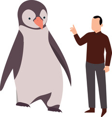 The boy is talking to the penguin.