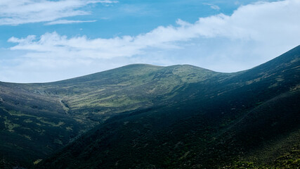 Naklejka premium high altitude mountain around sunset in summer