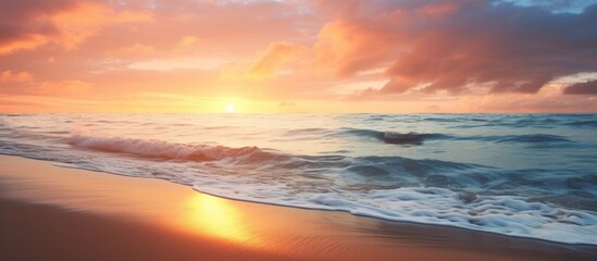 Beautiful sunset at the beach with a picturesque view of the sea sand and a play of sunlight and shadows Ideal for a copy space image