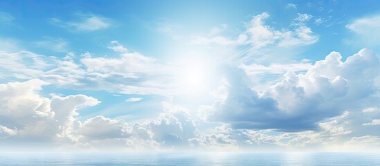 Obraz premium Beautiful summer sky with light clouds over the sea providing a stunning backdrop for a copy space image