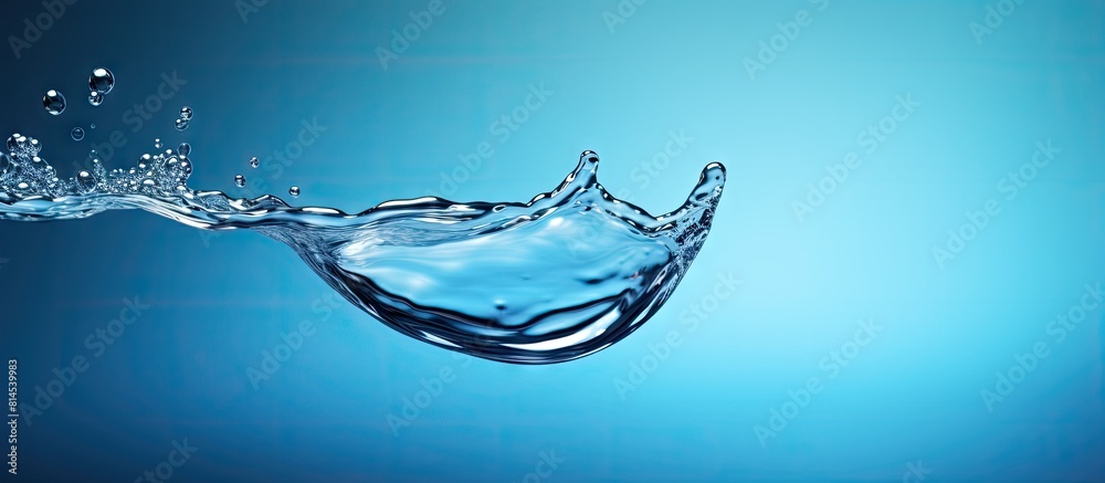 Aufkleber A drop of water caught in mid air suspended in the frame with a blank space around it creating the perfect copy space image