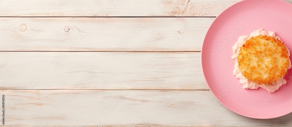 Poster Top down view of a fried camembert atop a pink plate situated on a pristine white wooden surface The arrangement offers ample copy space for text within the frame