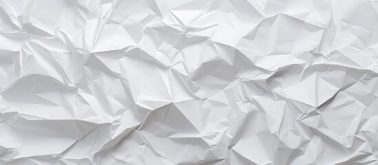 Obraz premium A white crumpled paper provides a textured background for copy space image