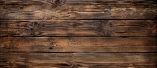An aged wooden plank board serves as a textured surface for a backdrop. with copy space image. Place for adding text or design