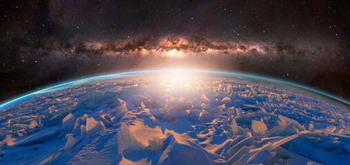 Planet earth completely covered in ice and amazing sunrise and Milky Way Galaxy in the background 