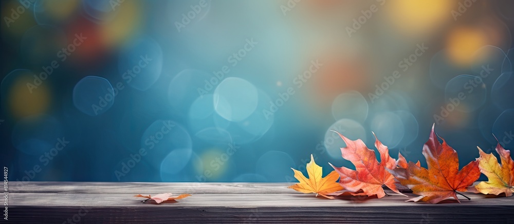 Poster Autumn leaves providing a colorful display on a table with ample copy space image