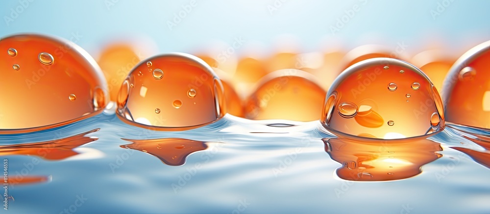 Poster Bright round gel balls made of orange hydrogel are displayed against a transparent water texture serving as a fresh and colorful background for a copy space image