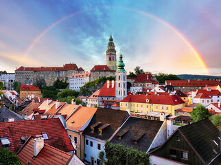 Cesky Krumlov with castle, old town and church with rainbow, Czech Republic