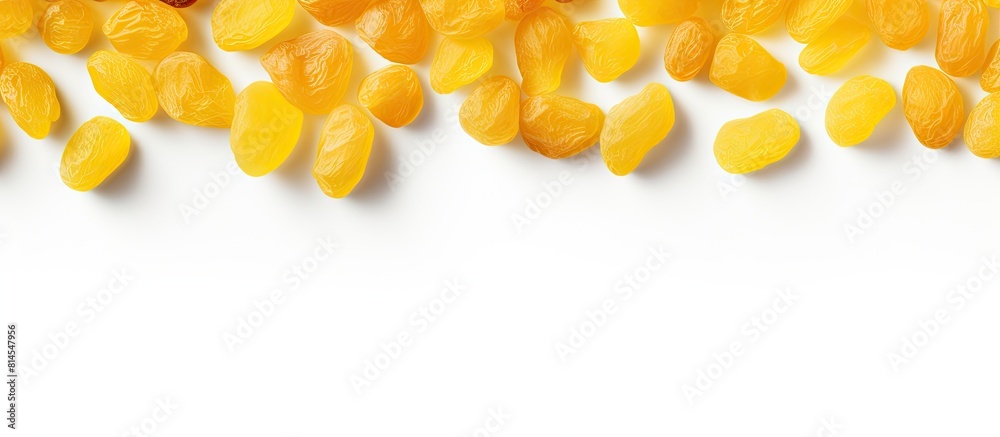 Poster A copy space image of yellow raisins seen from above set against a white background allowing room for text