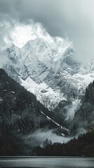 Idyllic view of snowcapped mountains against dramatic sky
