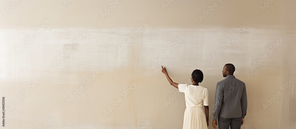 Poster an unidentified african american couple holds hands while the woman points and directs her gaze towa