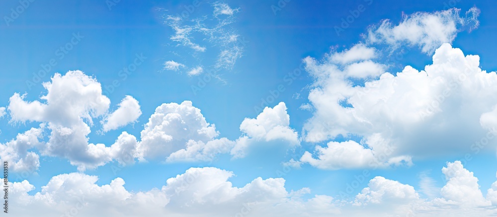 Poster a bright and sunny day with clear blue skies scattered clouds and ample copy space image