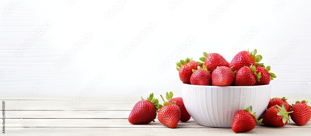 Poster healthy food consisting of red strawberries arranged in a cup on a white washed wood surface with am